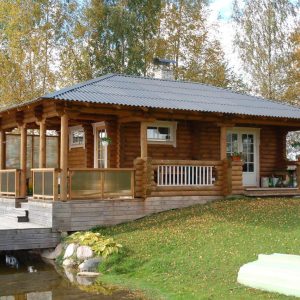 190mm Durchmesser Rundholz Ferienhaus Blockhaus 31,6m² + 24,7m² L-Form Terrasse, Fenstern, Türen im Wunschfarbton